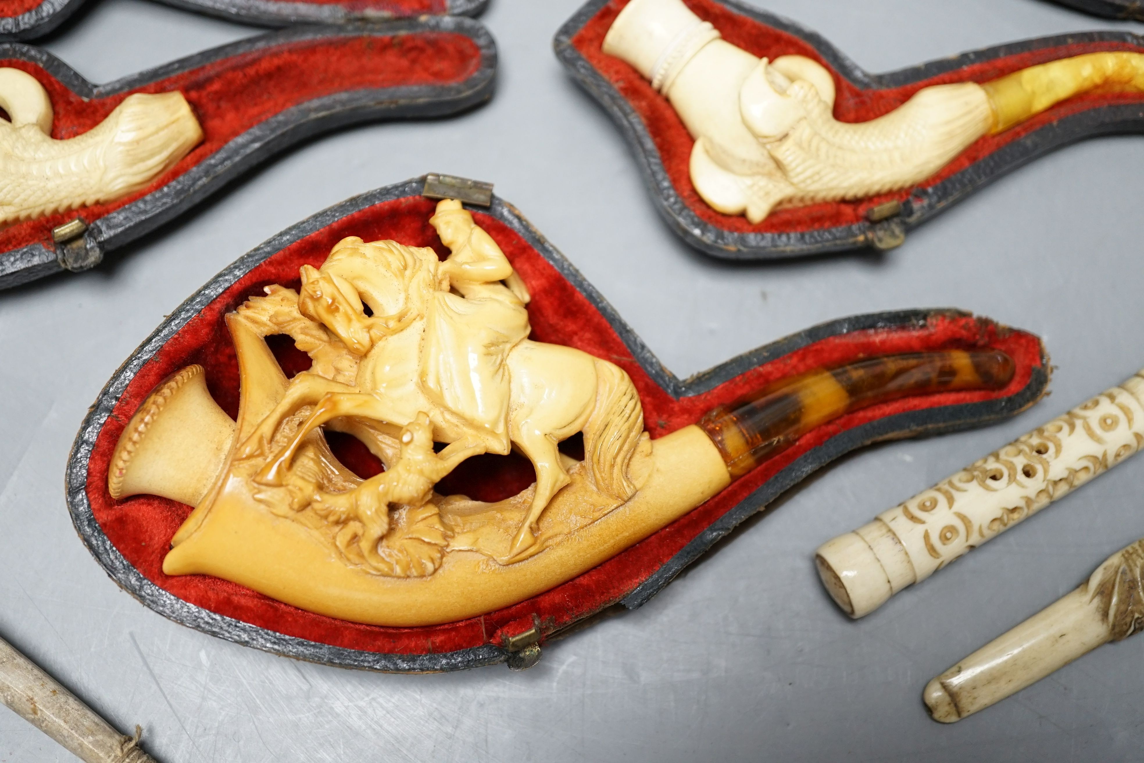 Three cased meerschaum pipes, another pipe and two bone cheroot holders